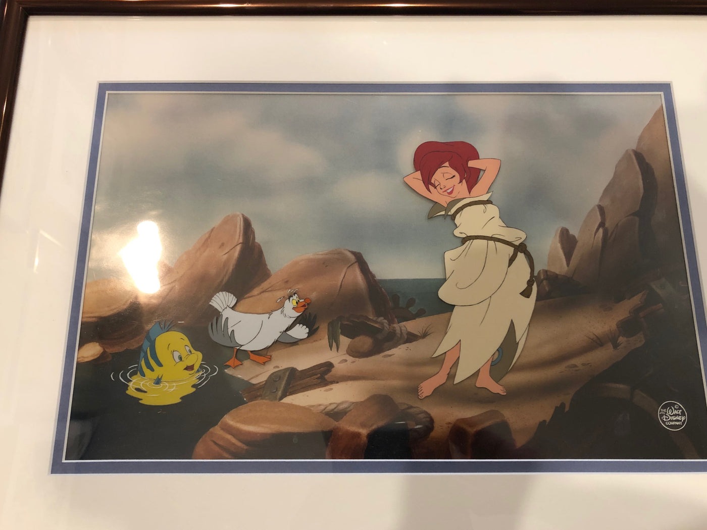 Original Walt Disney Three Production Cel Set-up on Color Photographic background featuring Ariel, Scuttle, and Flounder
