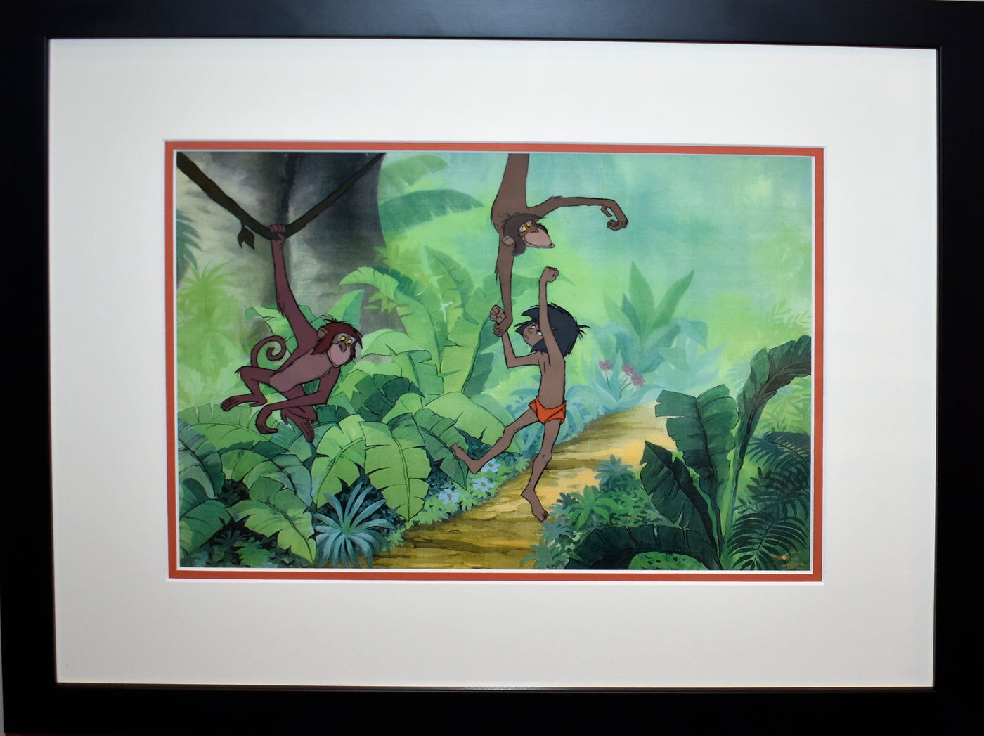 Original Walt Disney Production Cel with Color Copy Background from The Jungle Book featuring Mowgli