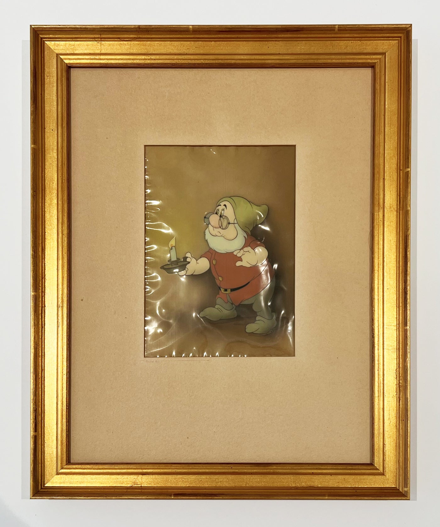 Original Walt Disney Production Cel on Courvoisier Background from Snow White and the Seven Dwarfs featuring Doc