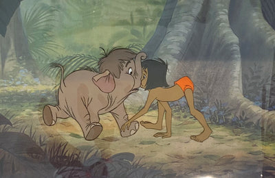 Original Walt Disney Production Cel from The Jungle Book featuring Mowgli and Hathi Jr.