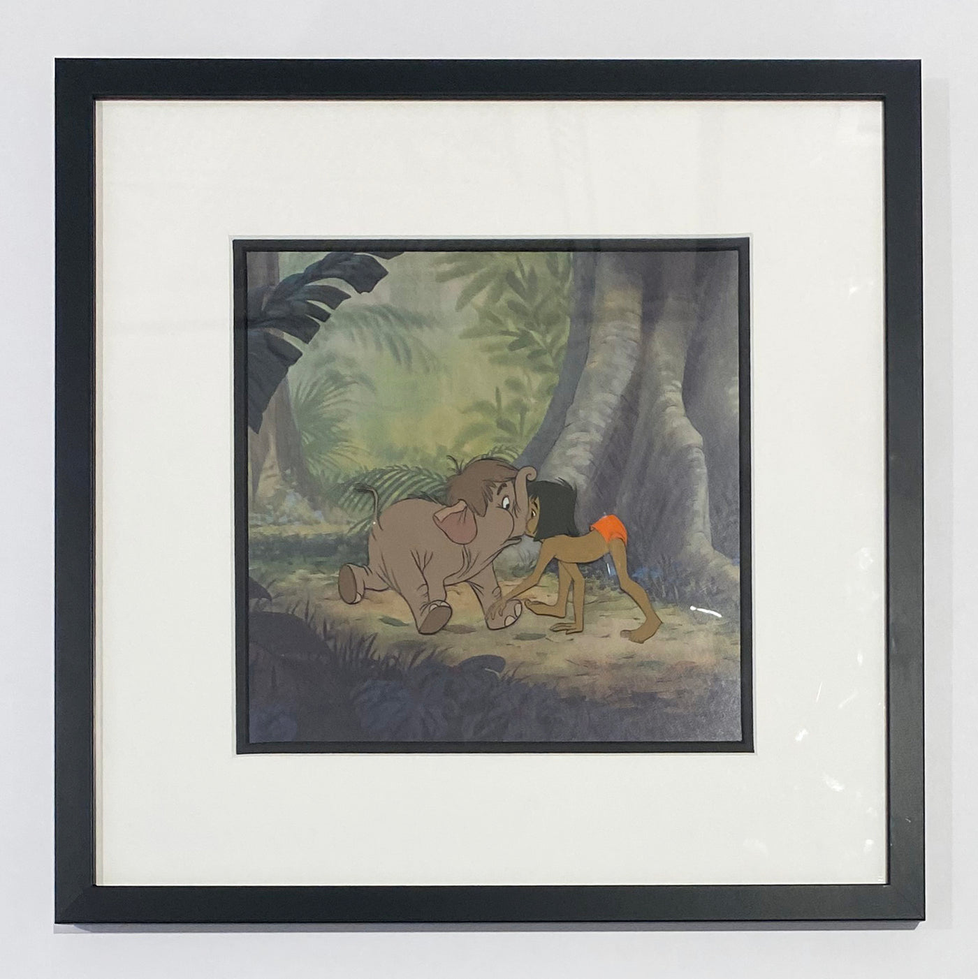 Original Walt Disney Production Cel from The Jungle Book featuring Mowgli and Hathi Jr.