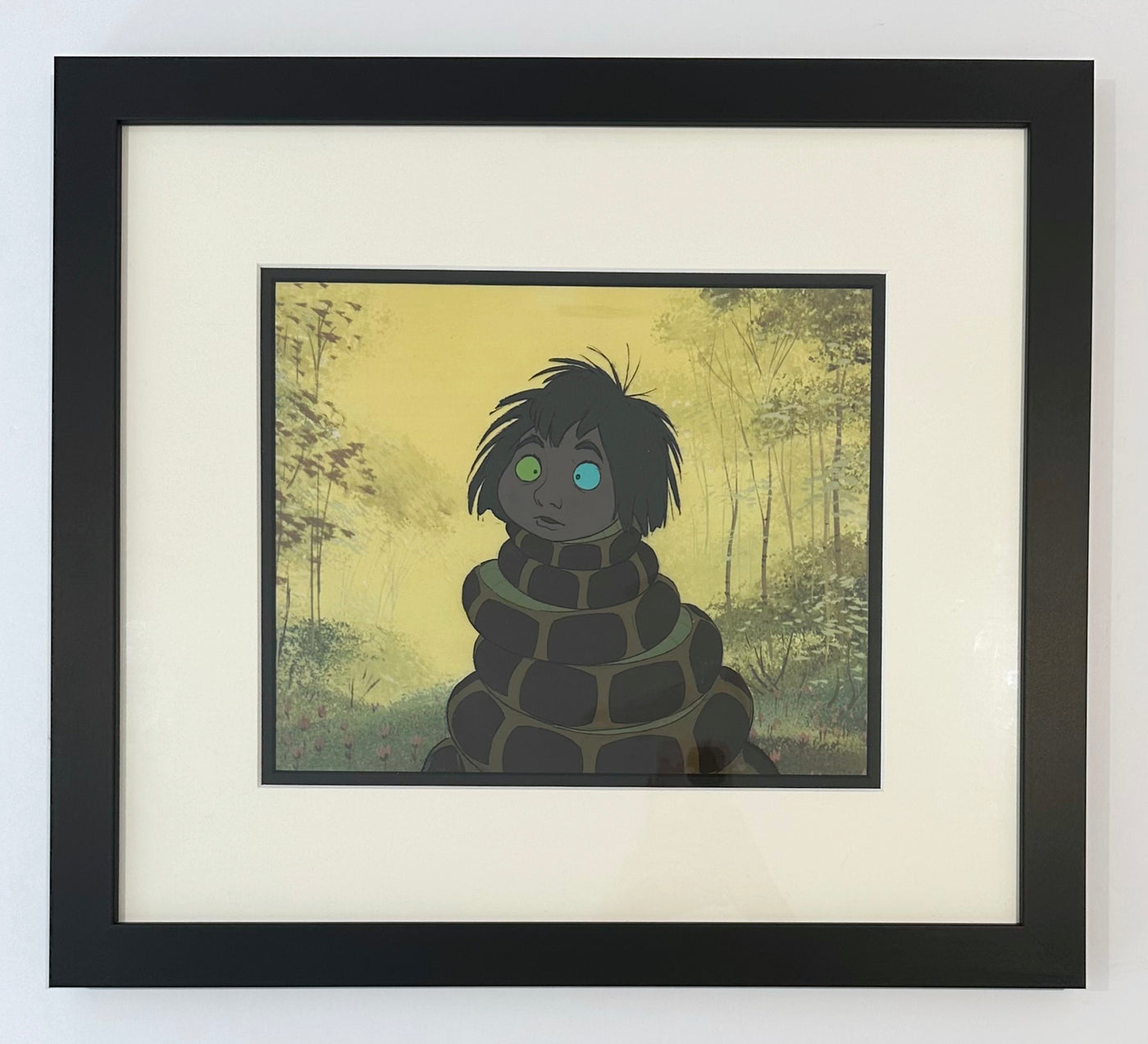 Original Walt Disney Production Cel from The Jungle Book featuring Mowgli and Kaa