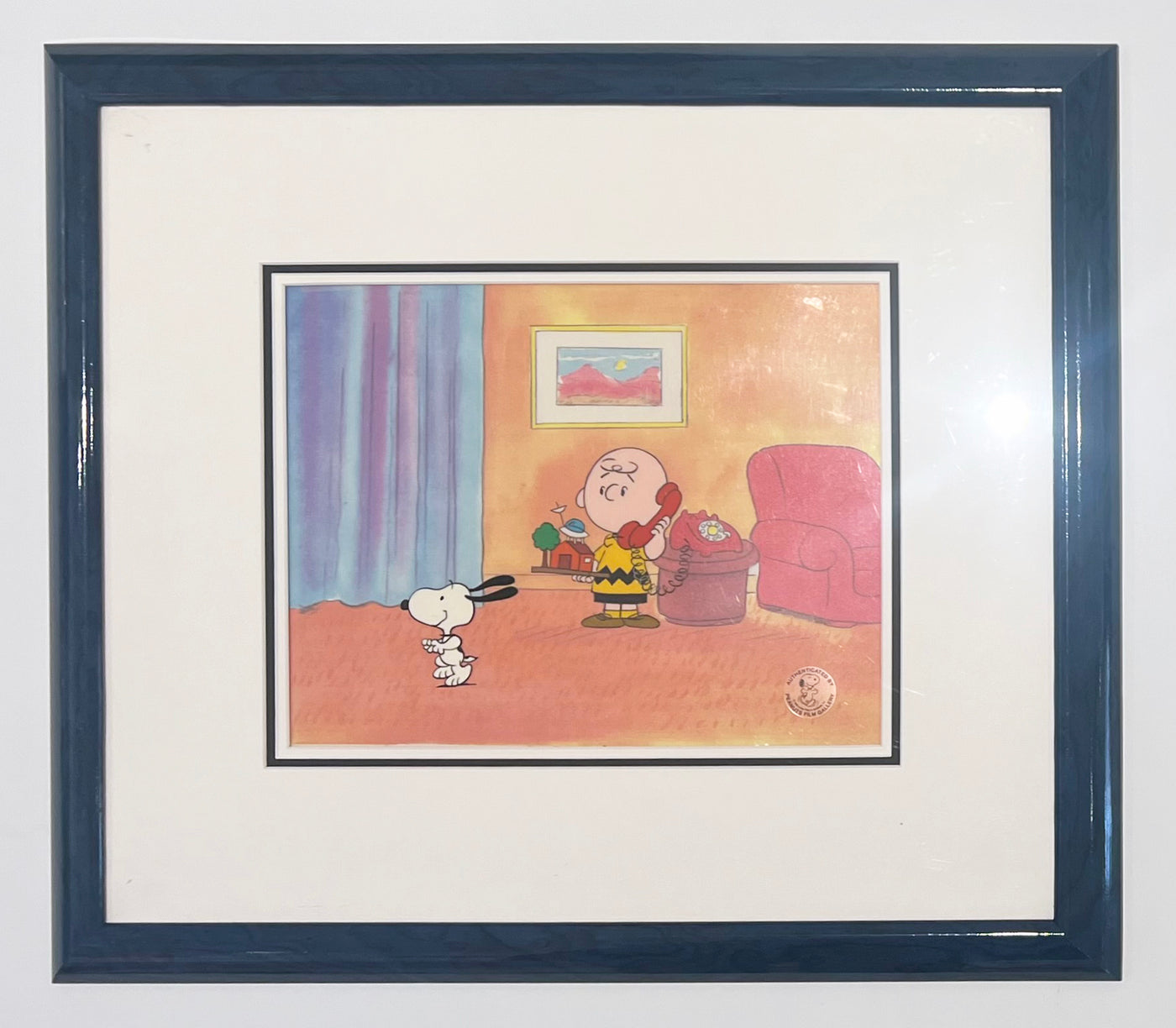 Original Peanuts Production Cel featuring Charlie Brown and Snoopy