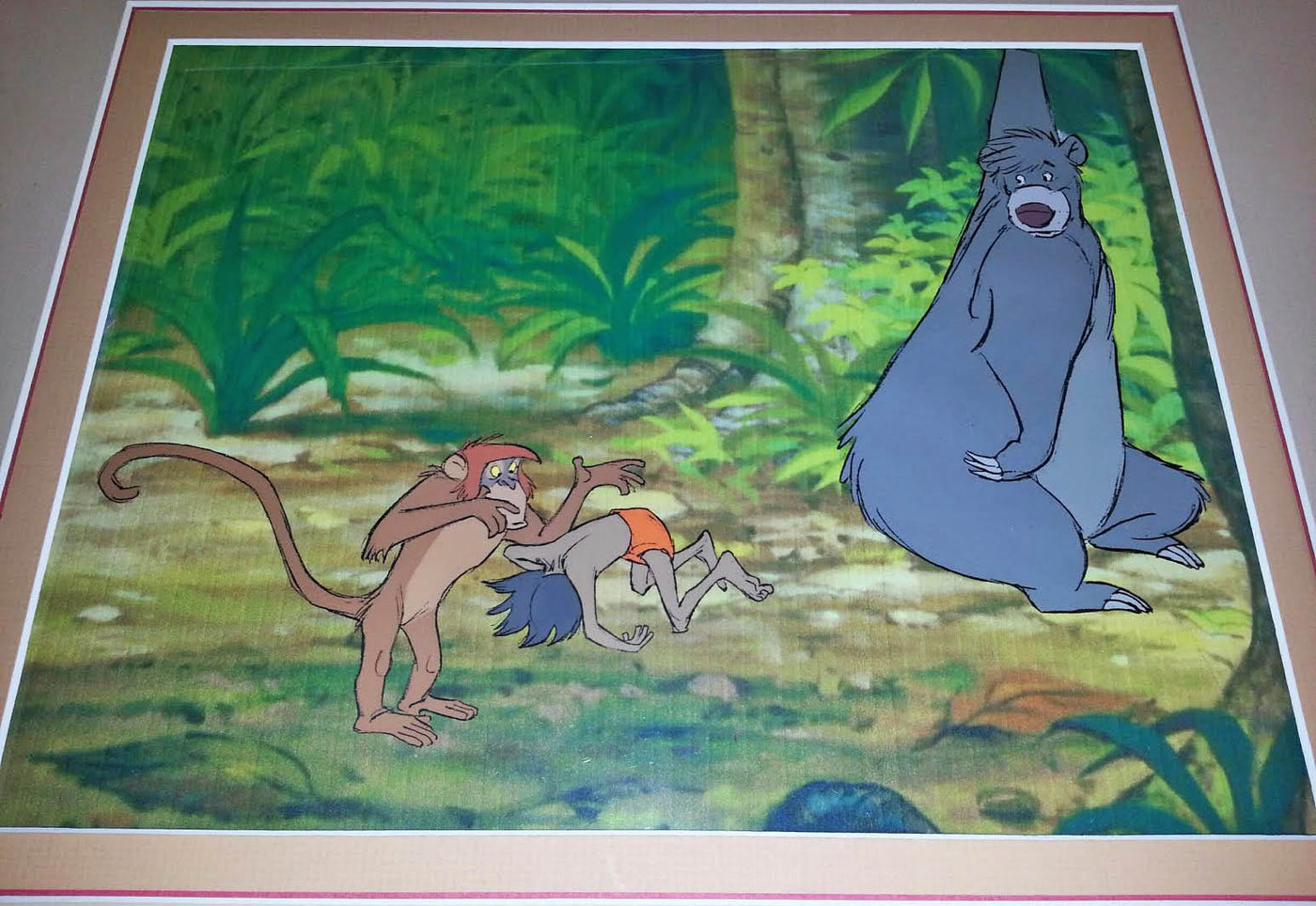 Original Walt Disney Production Cel from The Jungle Book featuring Baloo, Mowgli and Monkey
