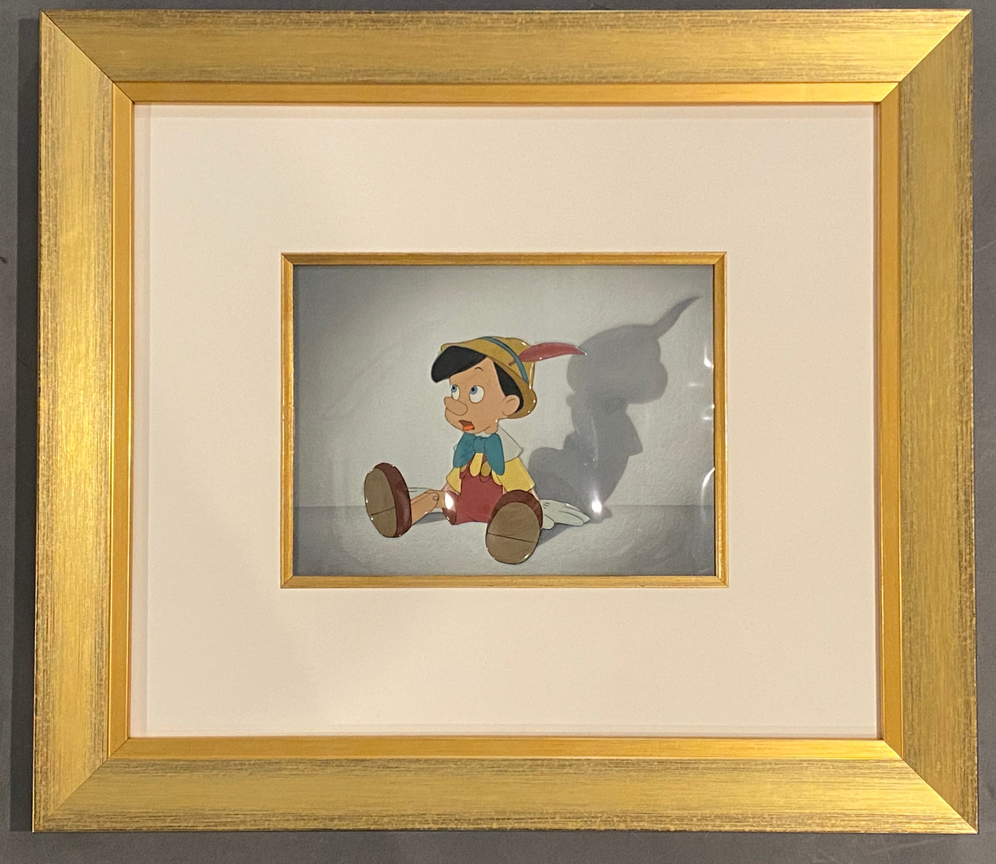 Original Walt Disney Production Cel of Pinocchio on a Courvoisier Background from Pinocchio (1940)