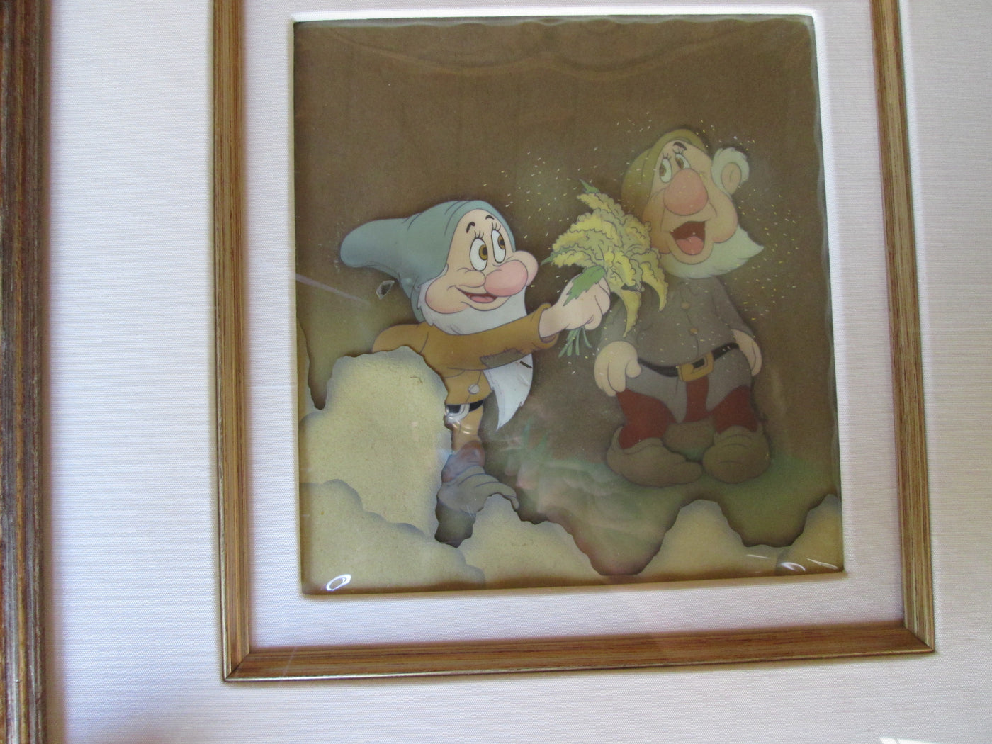 Original Walt Disney Production Cels on Courvoisier Background from Snow White and the Seven Dwarfs featuring Sneezy and Bashful