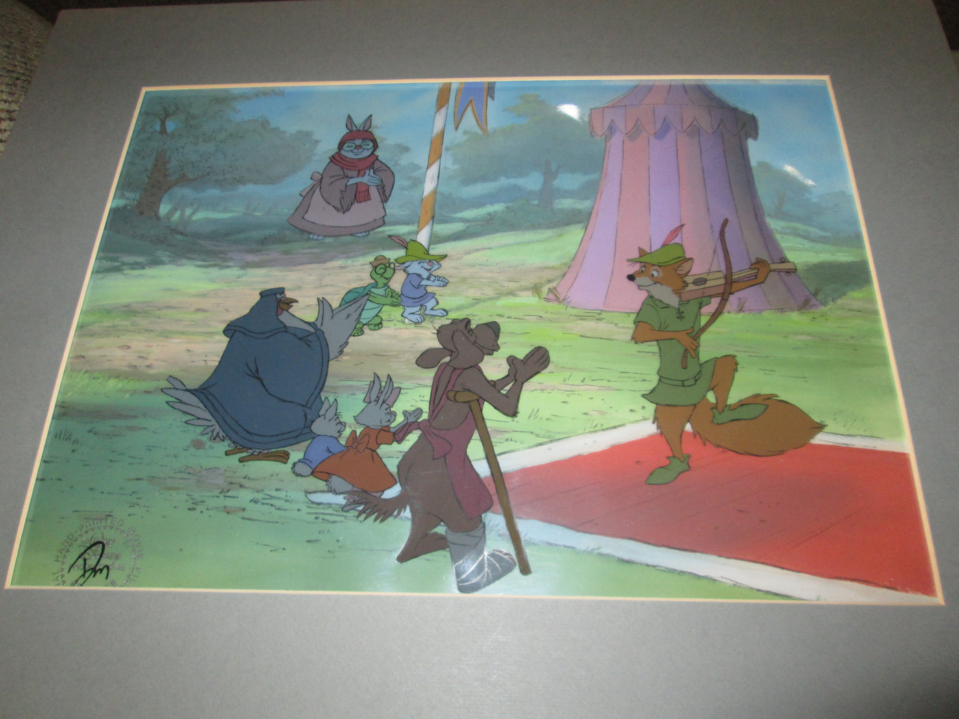 Original Disney Production Cel on Production Background from Robin Hood featuring Robin Hood, Otto, Sis, Tagalong, Lady Kluck, Toby Turtle, Skippy, and Mother Rabbit