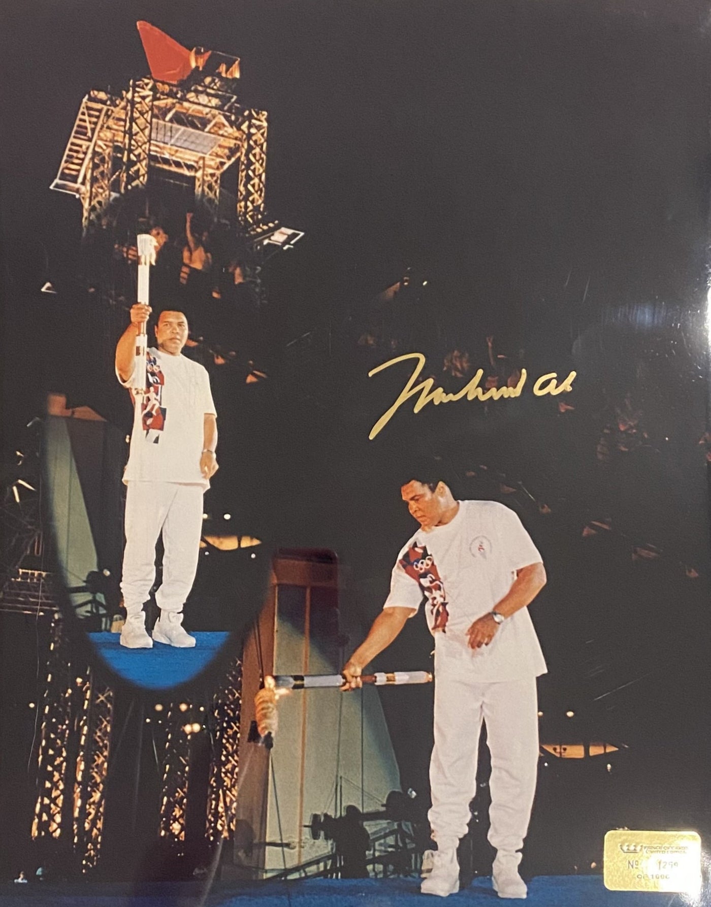 Photograph of Muhammad Ali Lighting 1996 Olympic Torch signed by Muhammad Ali