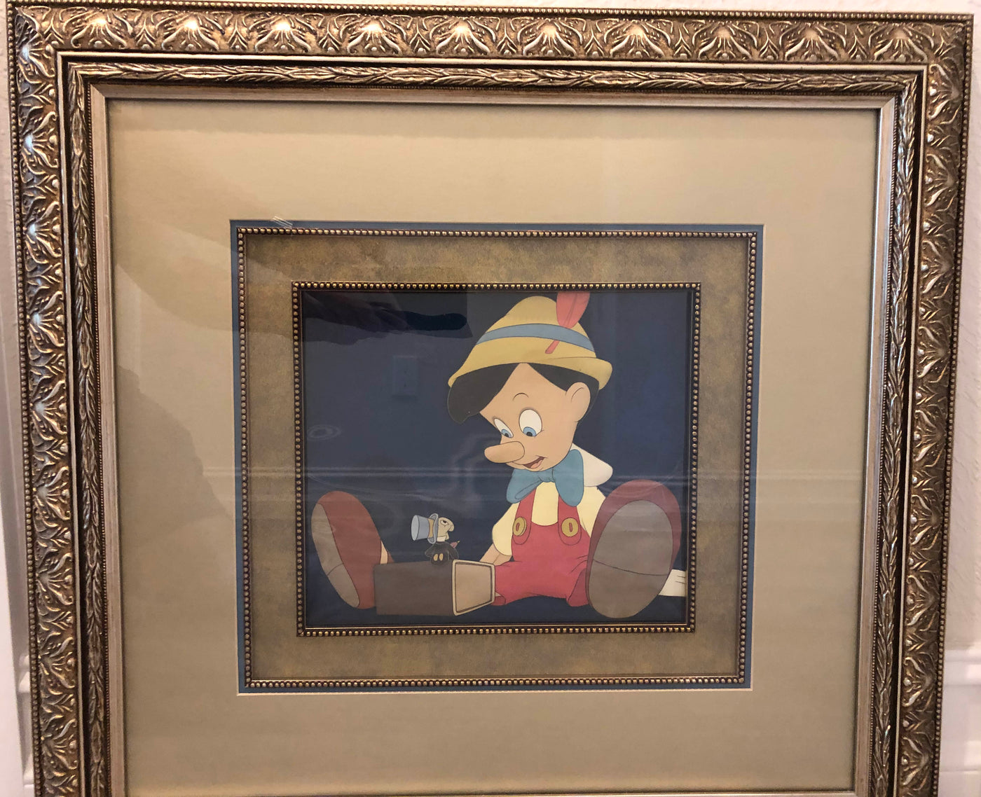 Original Walt Disney Production Cel of Pinocchio and Jiminy Cricket from Pinocchio on a Courvoisier Background