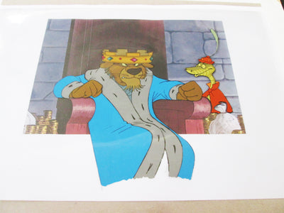 Original Disney Production Cel on Production background from Robin Hood featuring Prince John and Sir Hiss